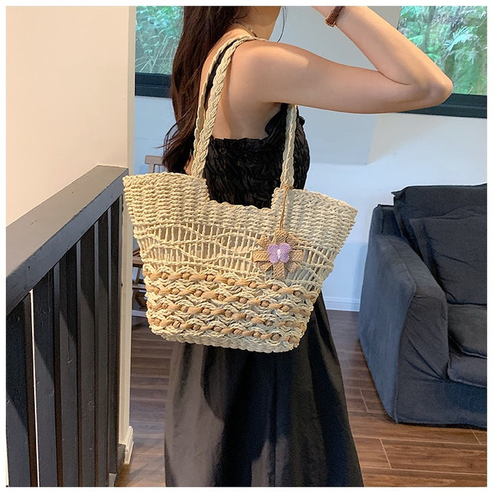 Handwoven beach bag with floral accents Kalsten