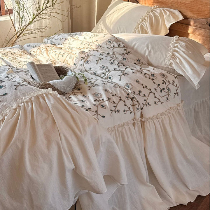 Bedding set with floral embroidered cover, gathered ruffle and cotton texture