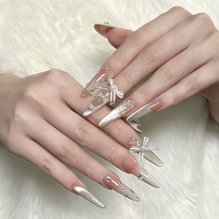 Elegant Stiletto Nail Art Extensions with Decorative Accents