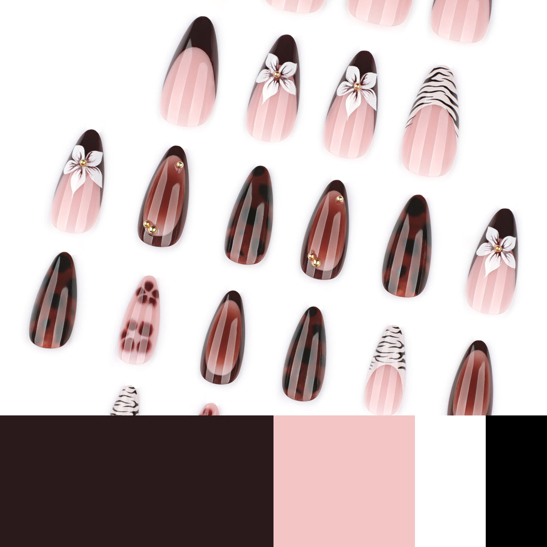 Artistic stiletto nails with elegant floral designs and glitter accents Kalsten