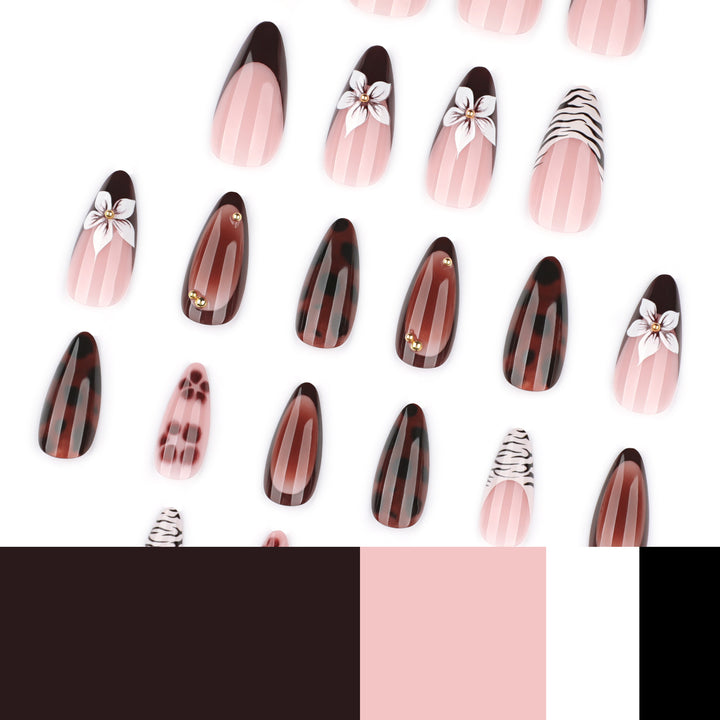 Artistic stiletto nails with elegant floral designs and glitter accents Kalsten
