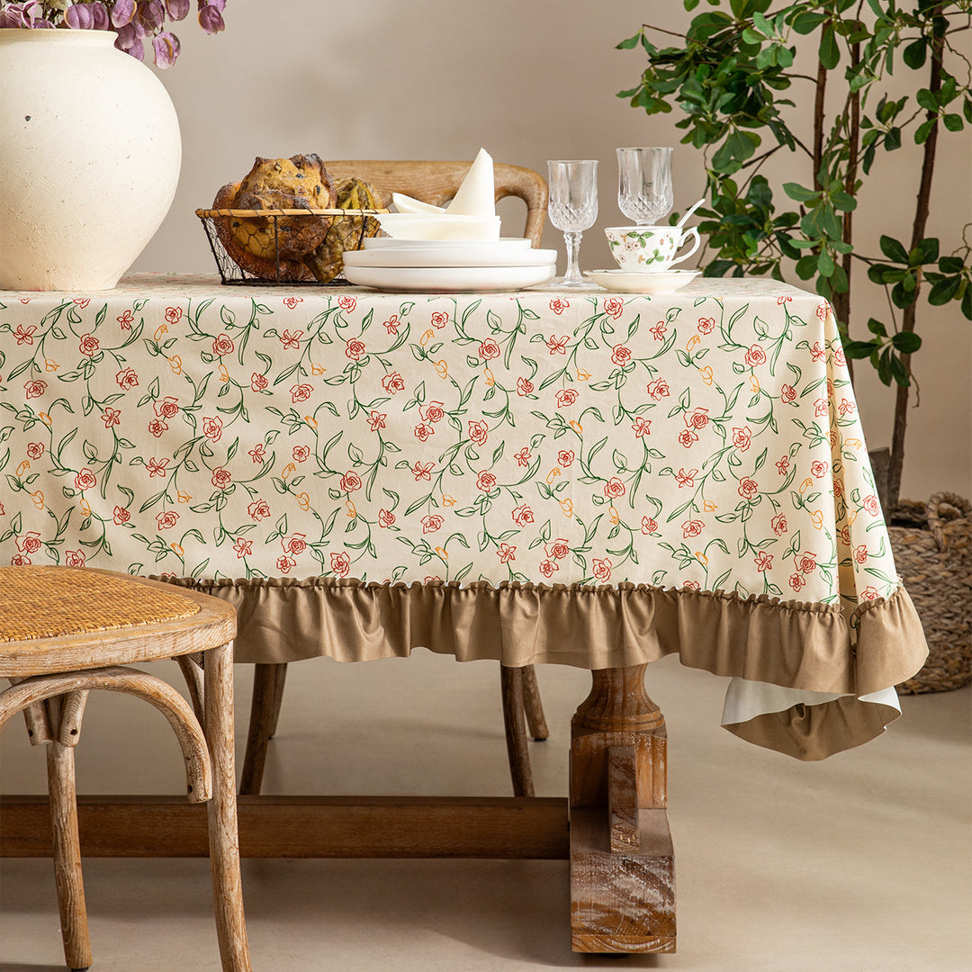 Rectangular tablecloth made of cotton blend fabric with fine floral print and gathered hem