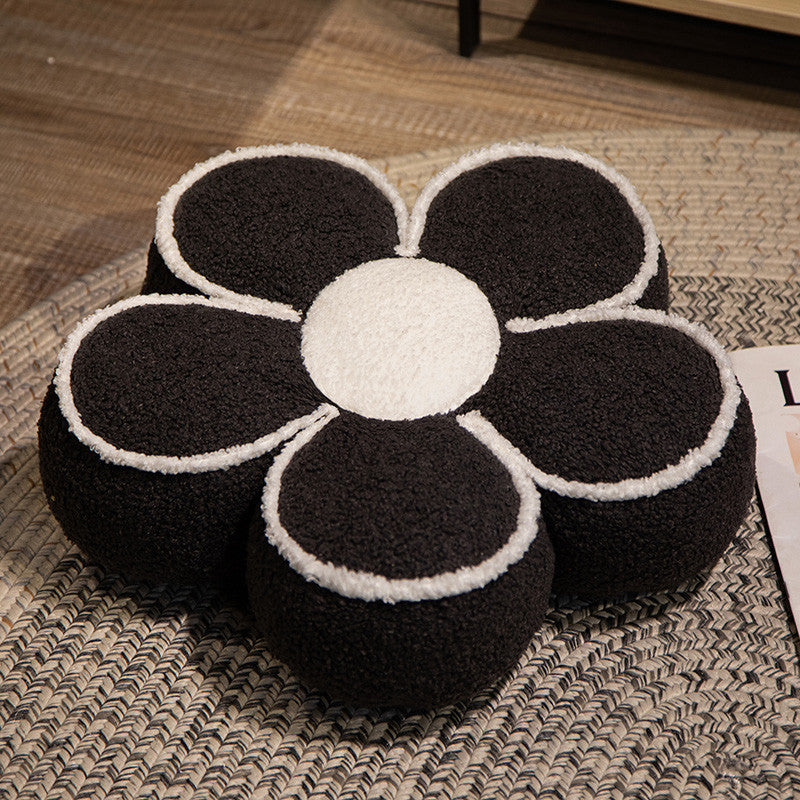 Padded seat cushion in flower shape with faux leather center piece and fluffy edge padding