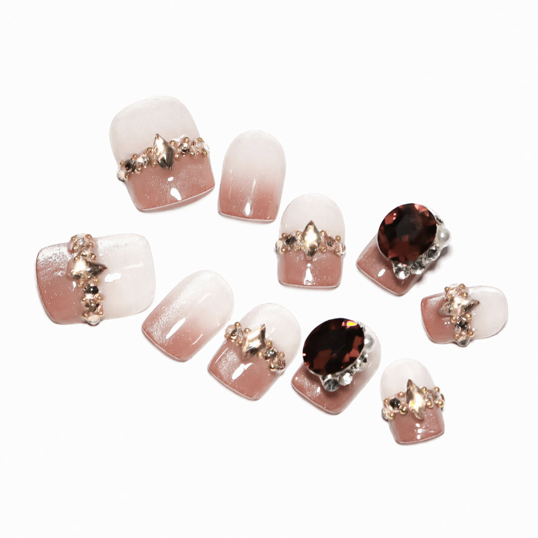 Artificial nail art with glitter and jewelry embellishments Kalsten