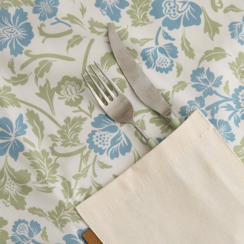 Cotton apron with floral pattern, adjustable neck strap and front pocket