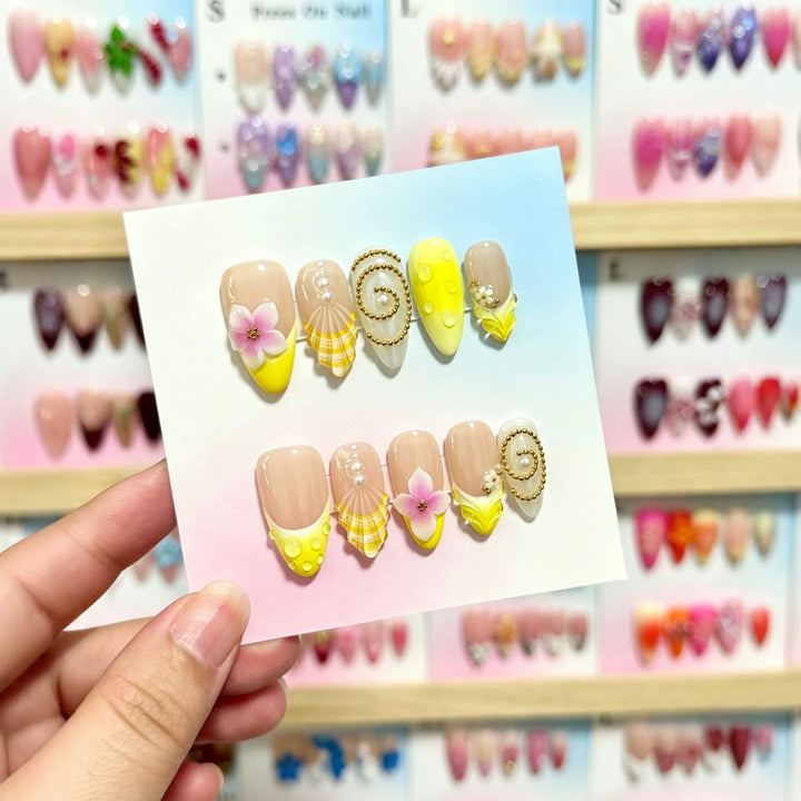 Artistic Press-On Nail Art Set with Floral and Shell Accents