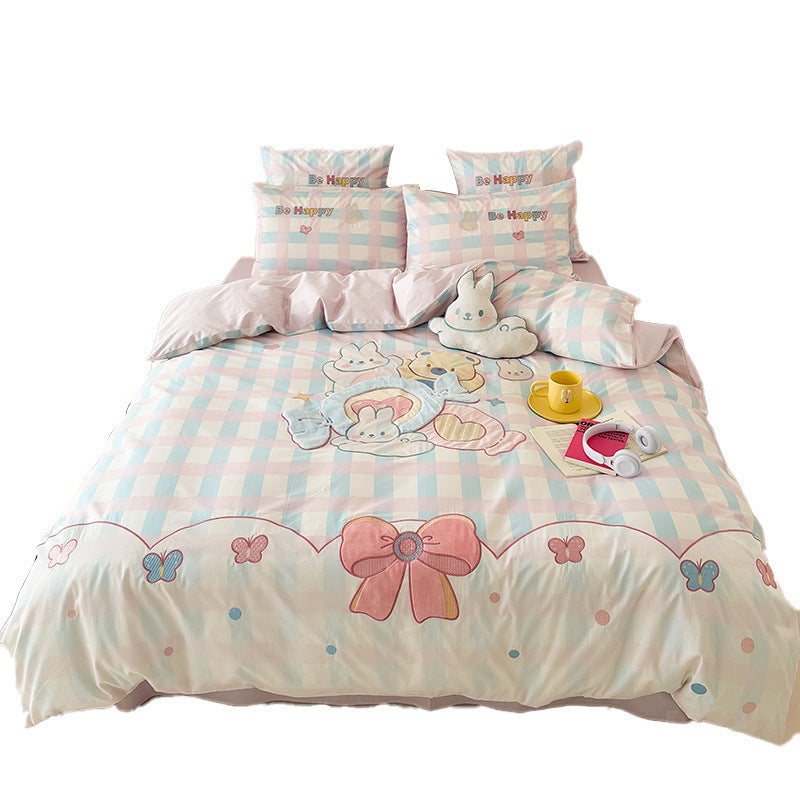 Playful cotton bedding set with embroidered bunny and cherry motif including decorative pillow