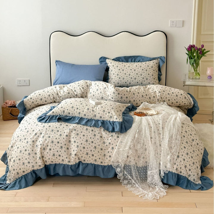 Romantic bed linen complete set made of cotton percale with delicate floral print, ruffle trim, and silky-matte finish