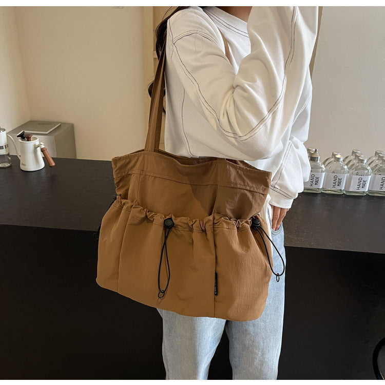 Practical everyday handbag with drawstring Kalsten