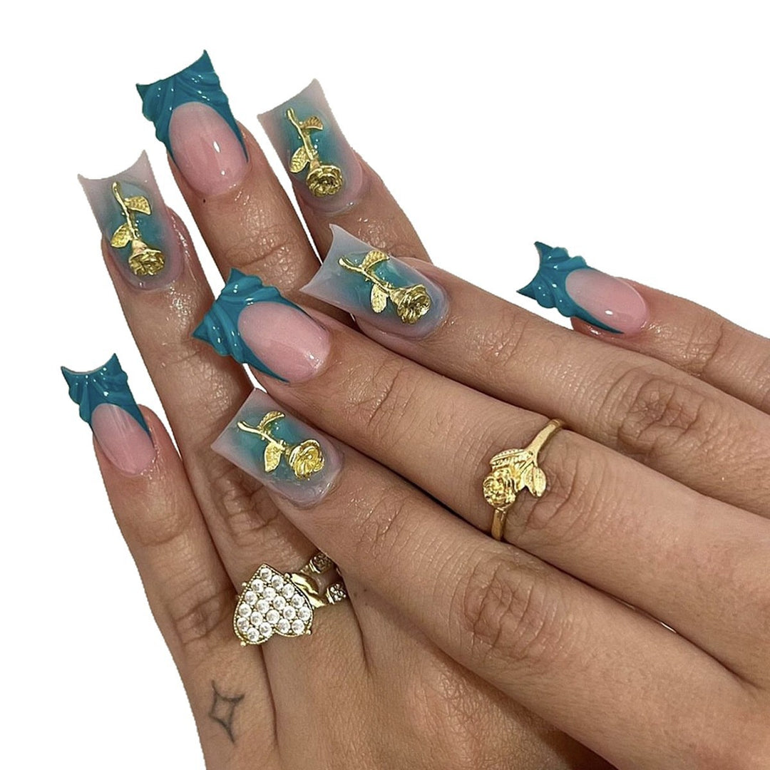 Elegant artificial nail creations with golden embellishments Kalsten