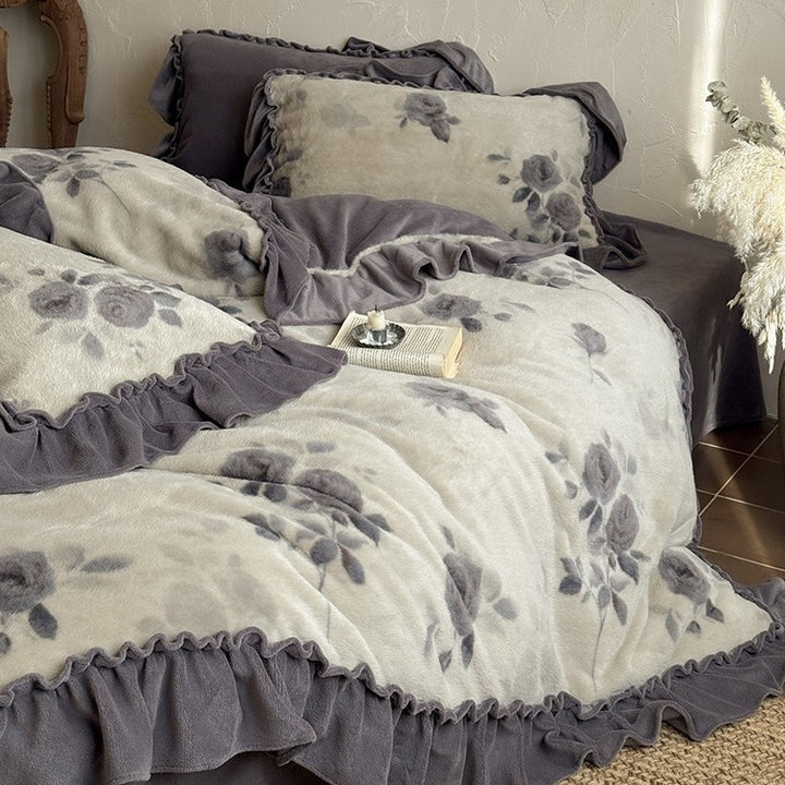 Microfleece bedding set with floral velour relief and decorative trim