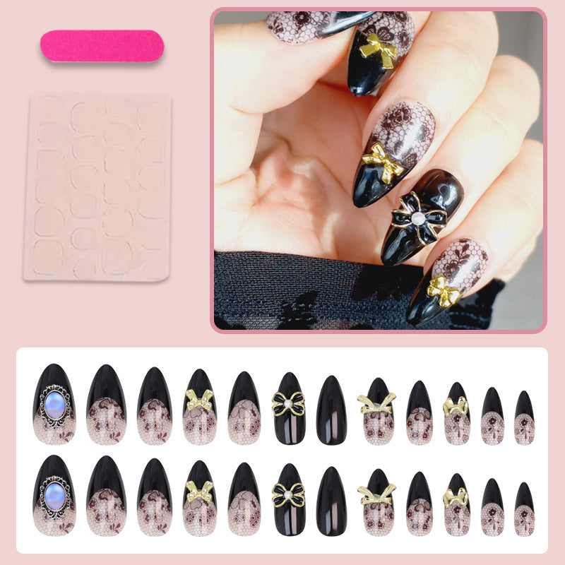 Artificial nail set with elegant dot and bow decorations Kalsten