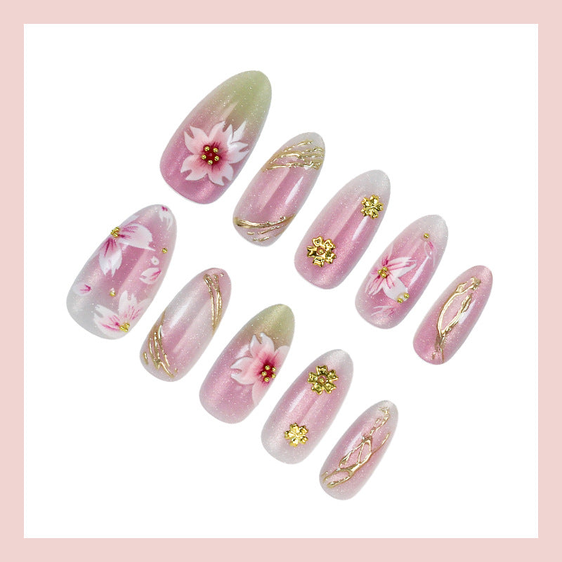 Artificial nails with floral design and gold accents Kalsten