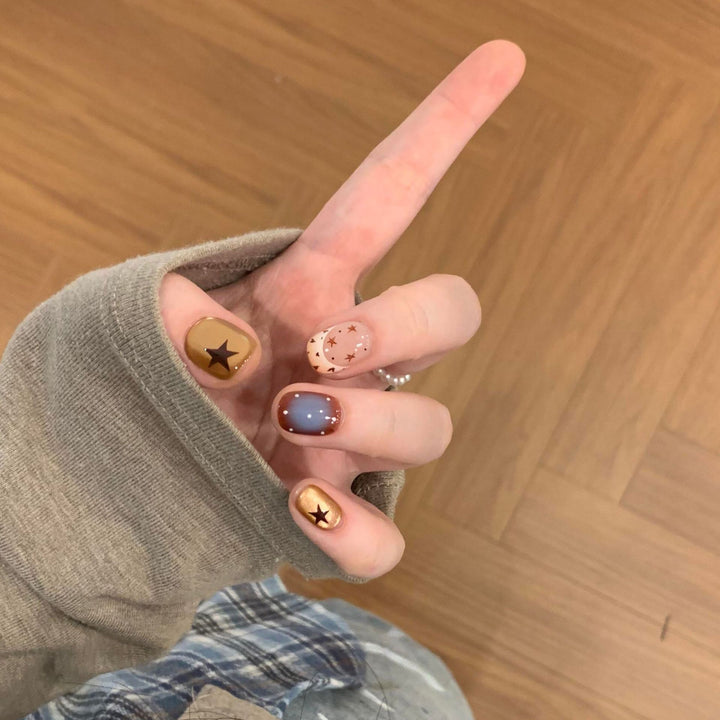 Artificial nails in modern design with star and gradient elements Kalsten