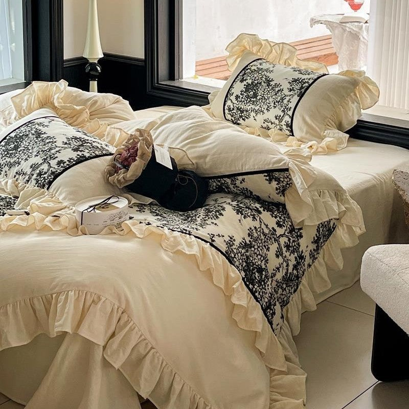 Romantic reversible bedding set made of fine cotton satin with ruffled flounces and toile design