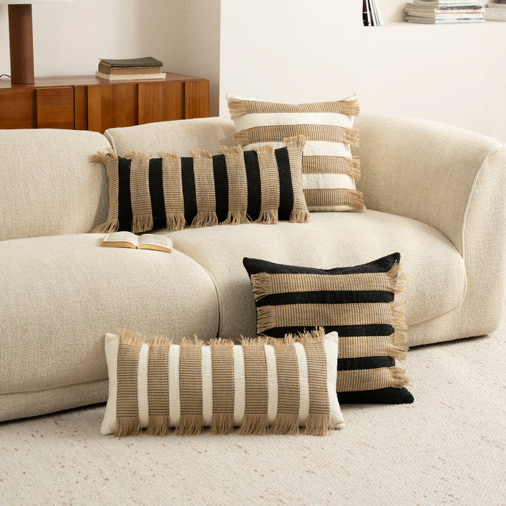 Woven cushion cover with bouclé surface and jute fringes Kalsten