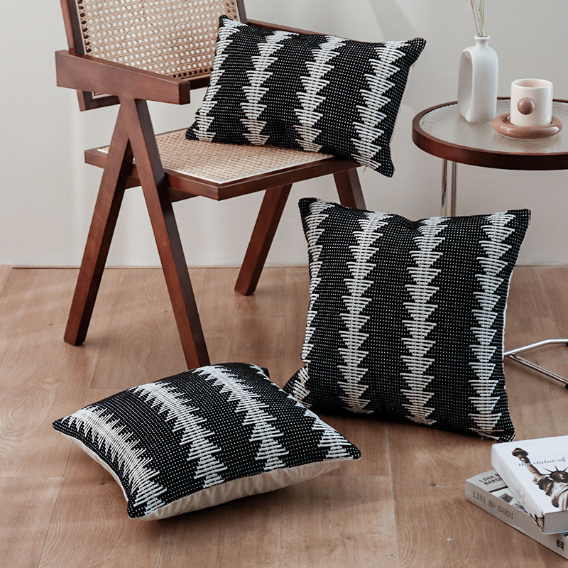 Square woven decorative cushion cover in tribal jacquard with pom-pom corners