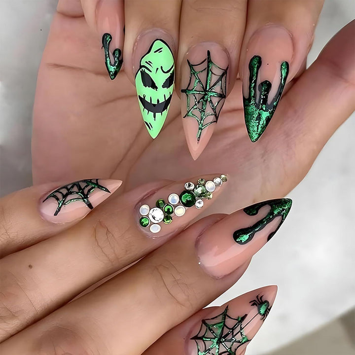 Acrylic nails with Halloween spider design and glitter accents Kalsten