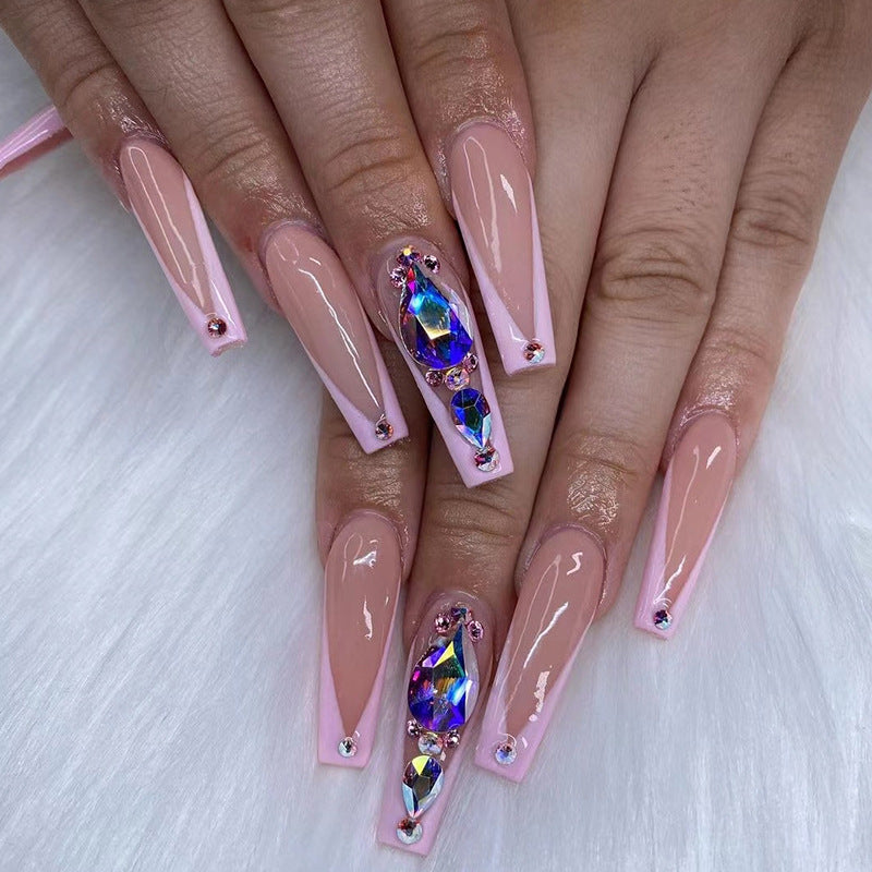 Artful nail extensions with rhinestone and flower accents Kalsten