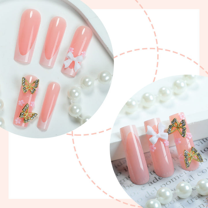 Artificial nail set with elegant butterfly and bow accents Kalsten