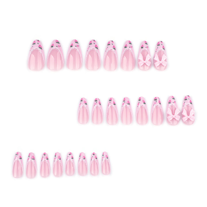 Artful stiletto nails with floral accents and bow embellishments Kalsten