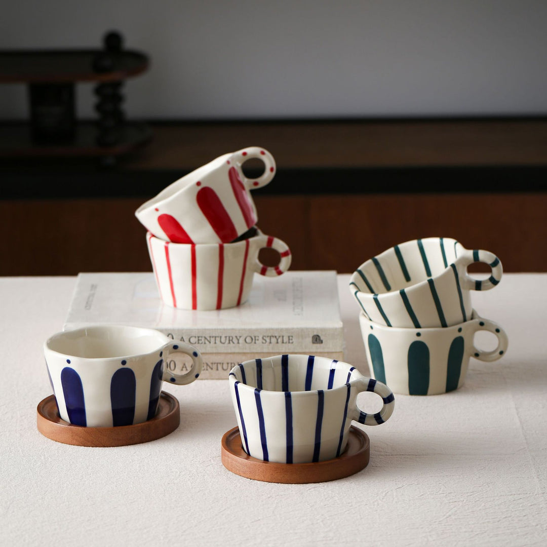 Ceramic espresso cup with round wooden coaster and handcrafted stripe pattern