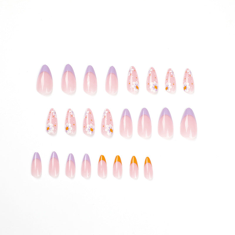 Artful nail art with floral accents and gradient colors Kalsten
