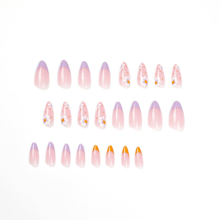 Artful nail art with floral accents and gradient colors Kalsten