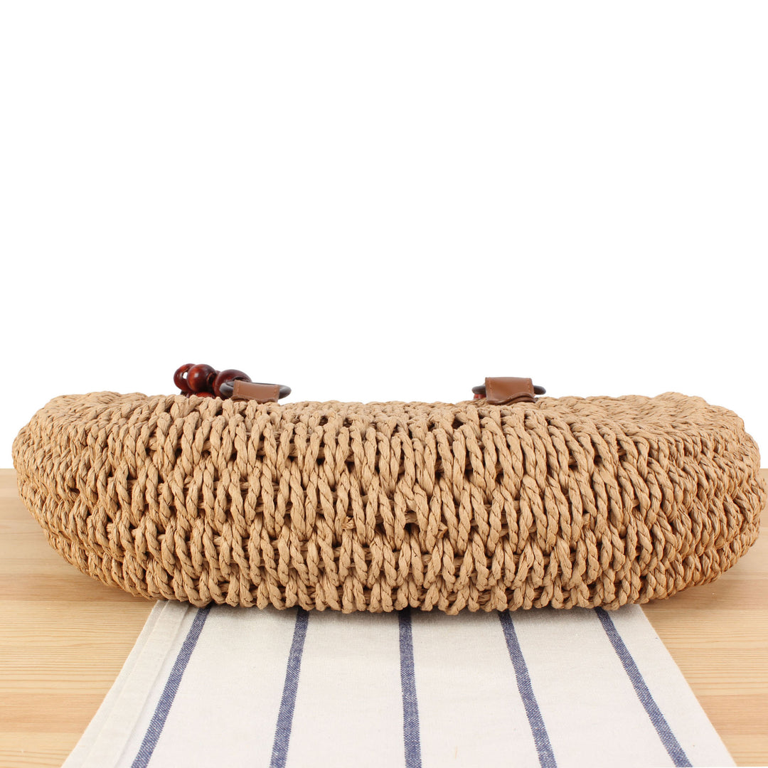 Basket bag with elegant wooden handles and textured surface Kalsten