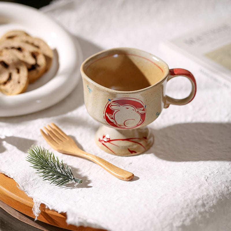 Ceramic foot mug with handle and hand-painted rabbit illustration