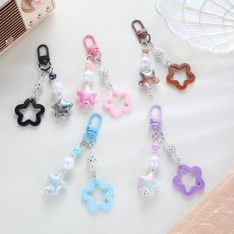 Playful keychain with floral and star motif Kalsten