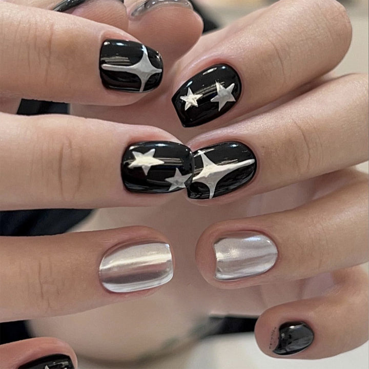 Artful Nail Art with Metallic and Star Motifs Kalsten