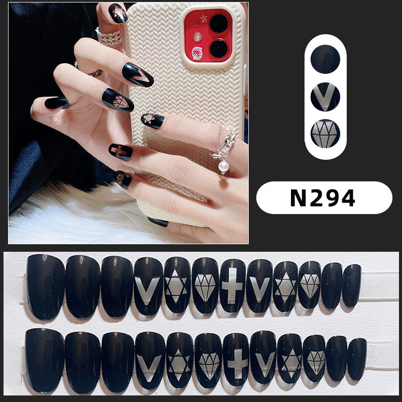 Artistic Press-On Nail Set with Geometric and Symbolic Designs