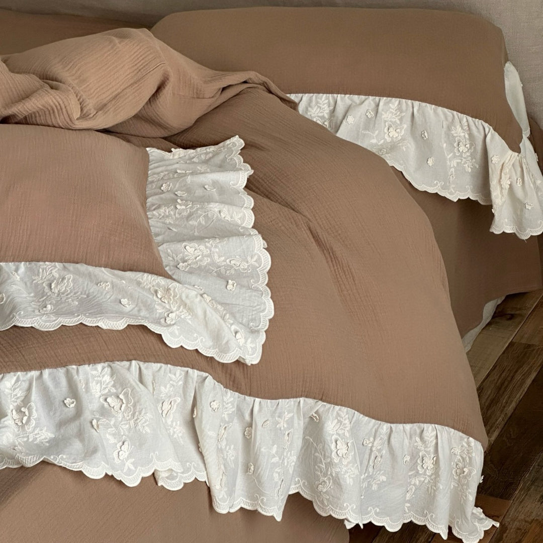 Quilted cotton duvet with embroidered frill and layered ruffled bed skirt