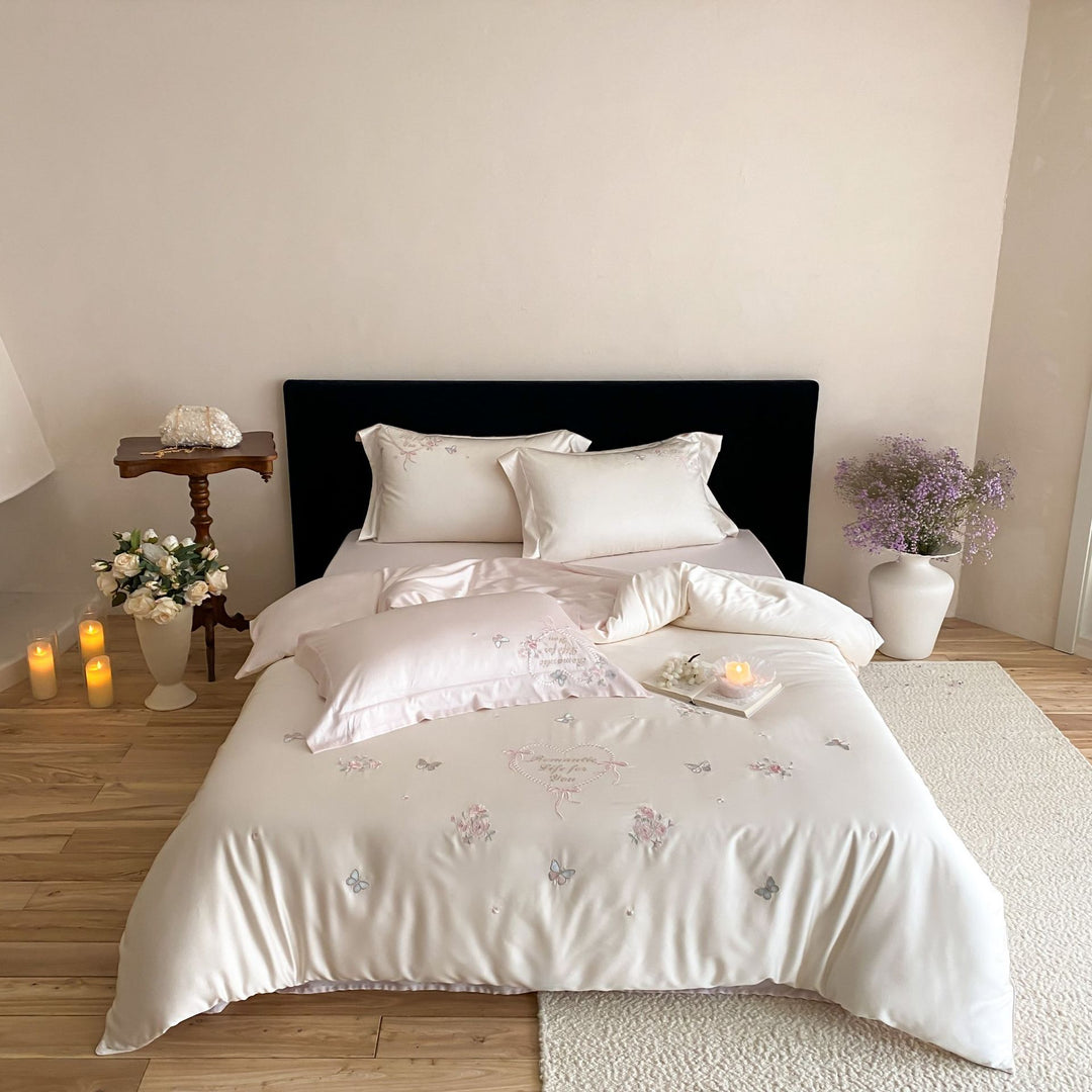 Luxurious embroidered cotton satin bedding set with delicate butterfly and flower appliqués