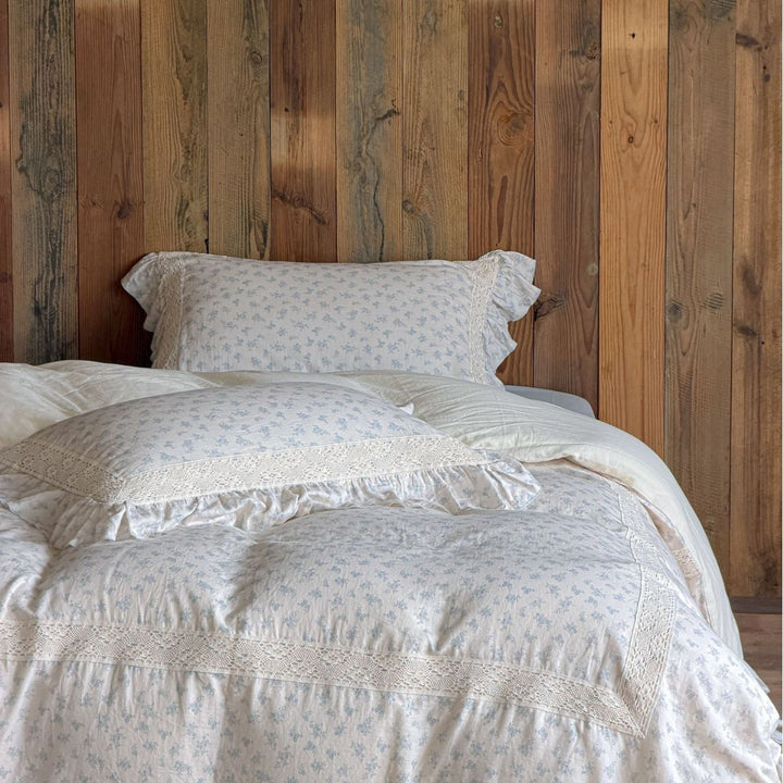 Vintage-inspired bedding set with lace appliqué and ruffle