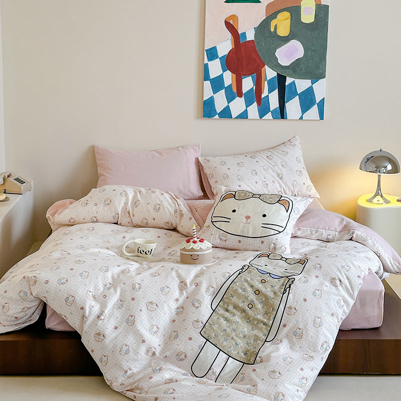 Bedding set with appliquéd doll motif and star pattern