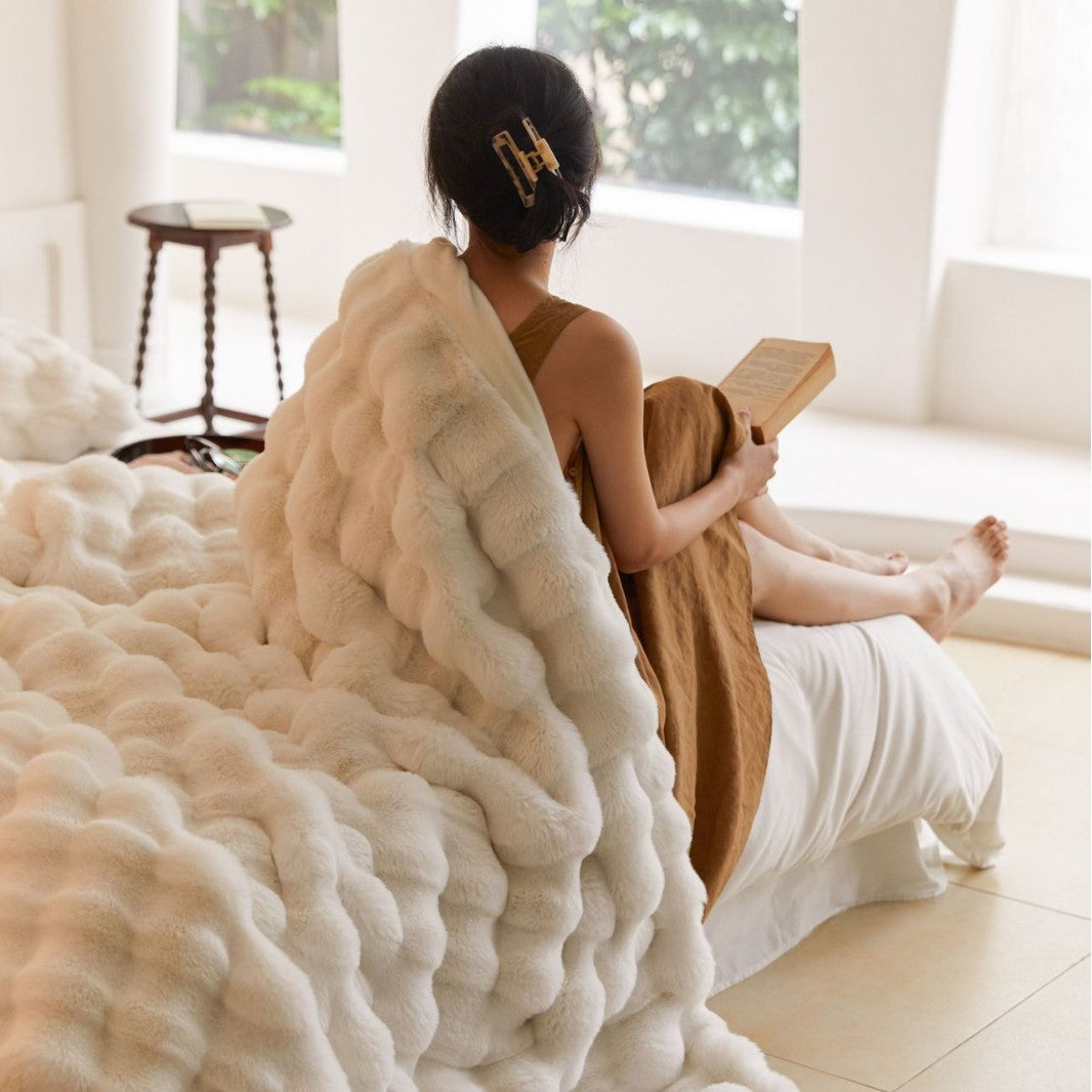 Cozy artificial fur throw blanket with wave structure and extra soft texture