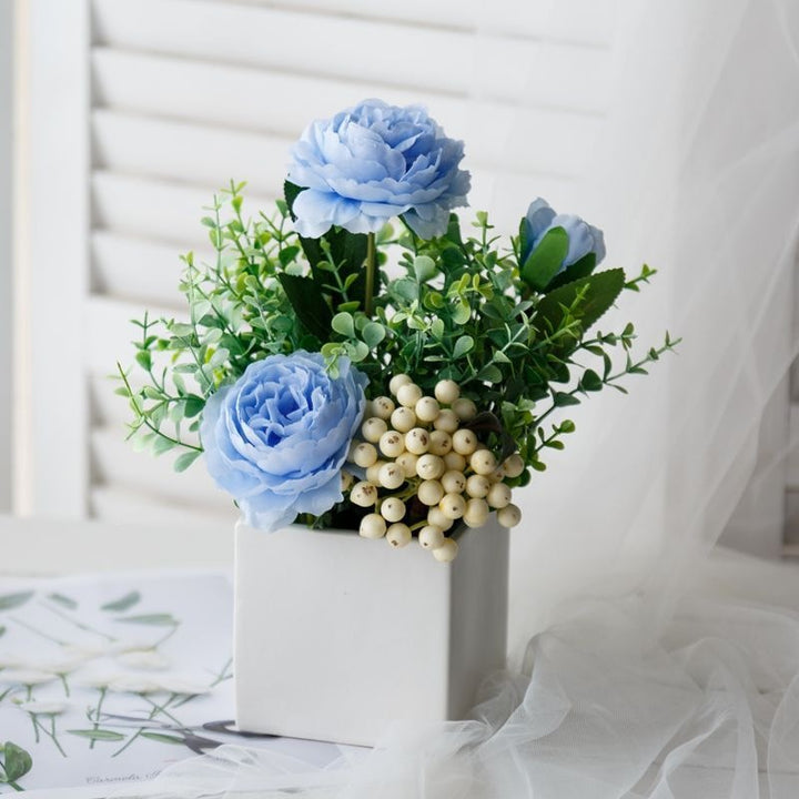 Lifelike Floral Arrangement in Decorative Square Planter