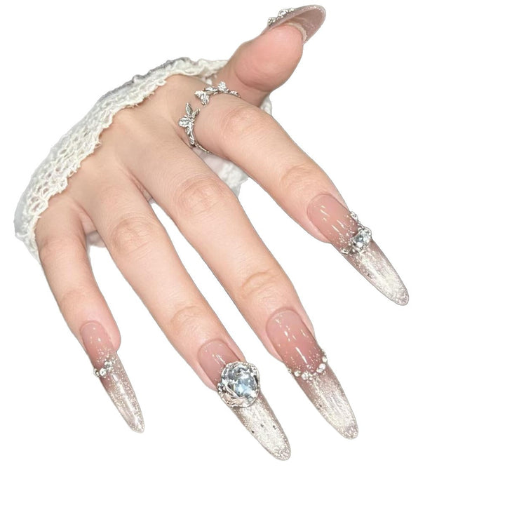 Artistic Stiletto Nail Enhancements with Gemstone Accents