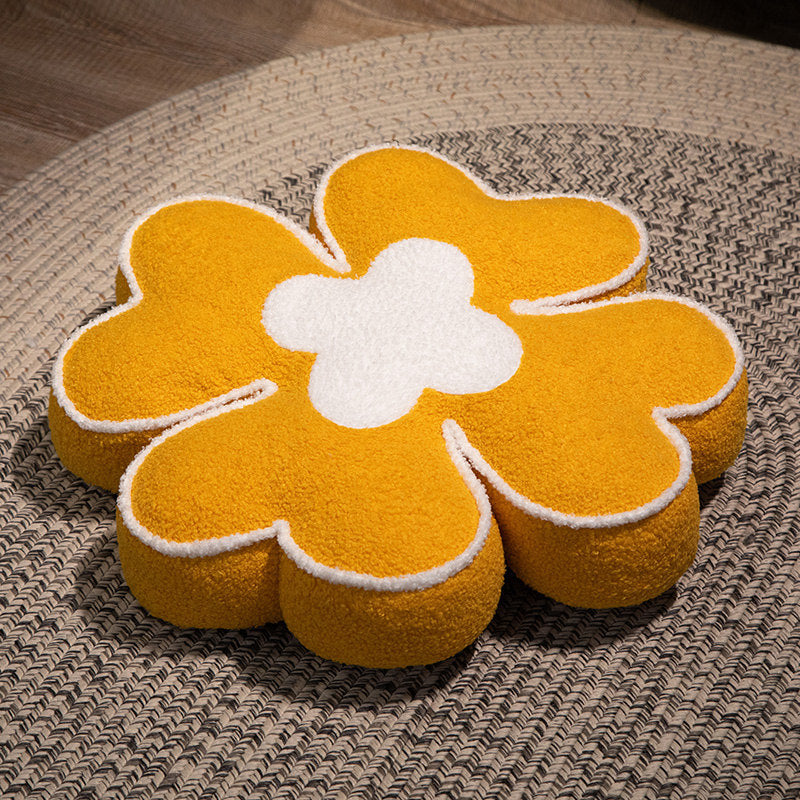 Padded seat cushion in flower shape with faux leather center piece and fluffy edge padding