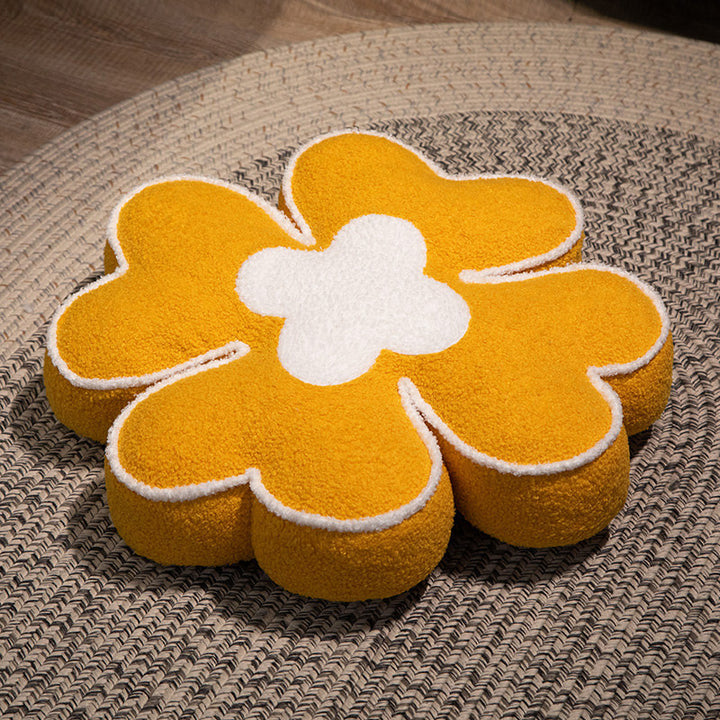 Padded seat cushion in flower shape with faux leather center piece and fluffy edge padding