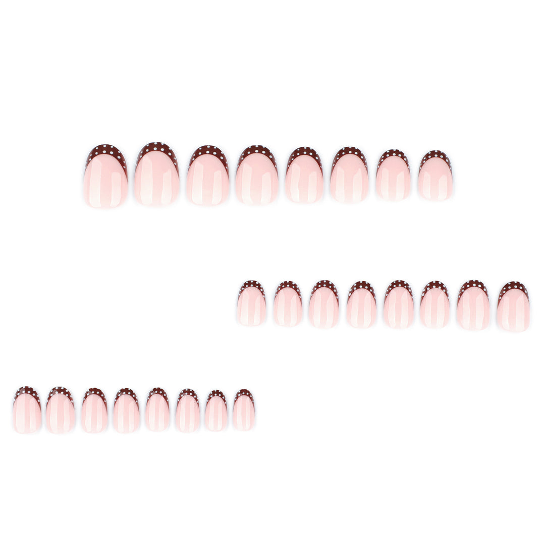 Artful nail design with elegant French tip and accents Kalsten
