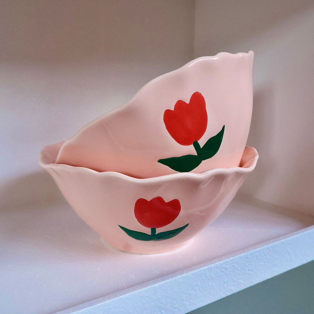 Decorative hand-painted ceramic bowl with wavy edge and tulip design
