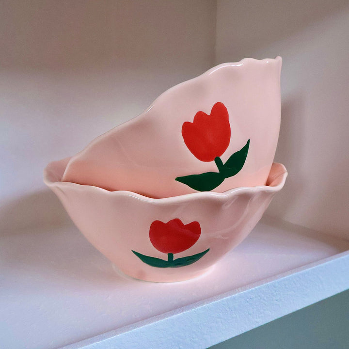 Decorative hand-painted ceramic bowl with wavy edge and tulip design