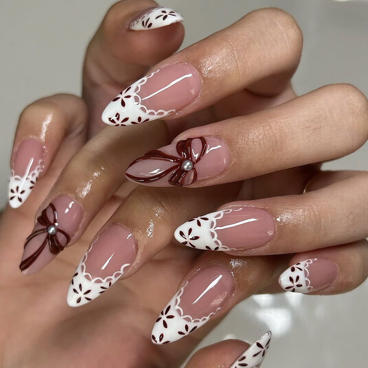 Elegant artificial nail design with floral accents Kalsten
