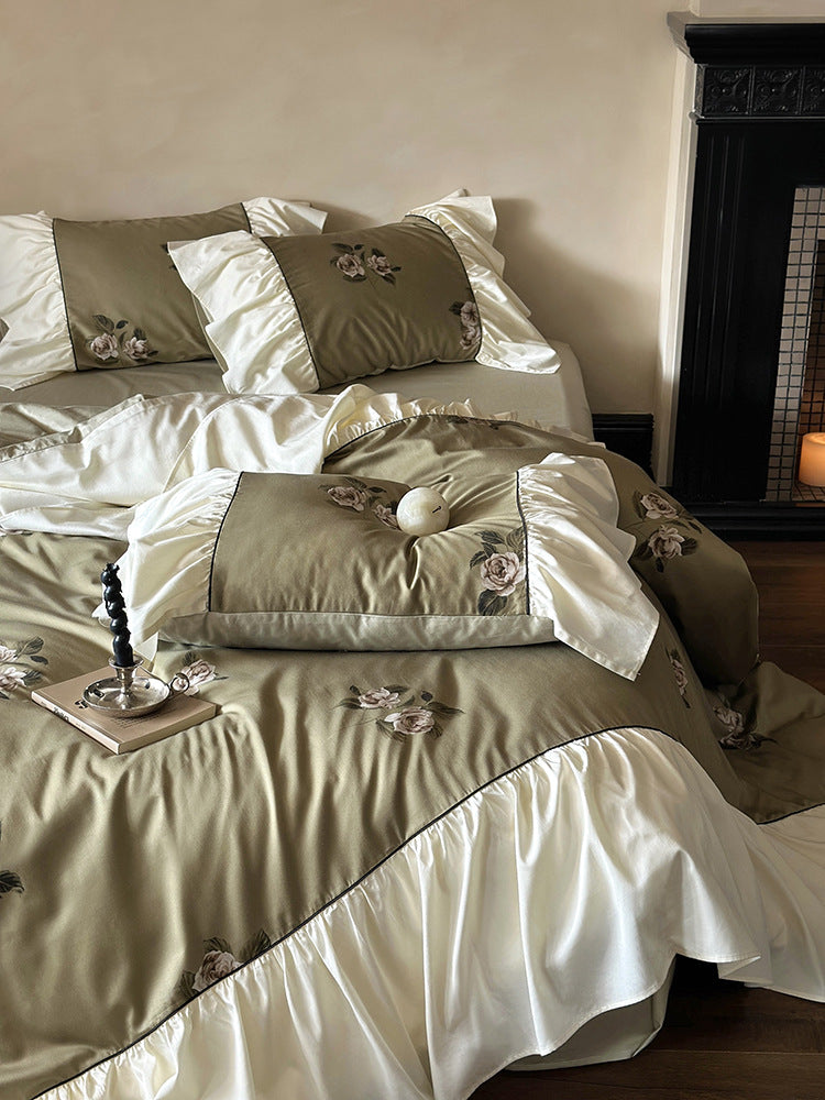 Luxurious satin bedding set with floral embroidery and frills