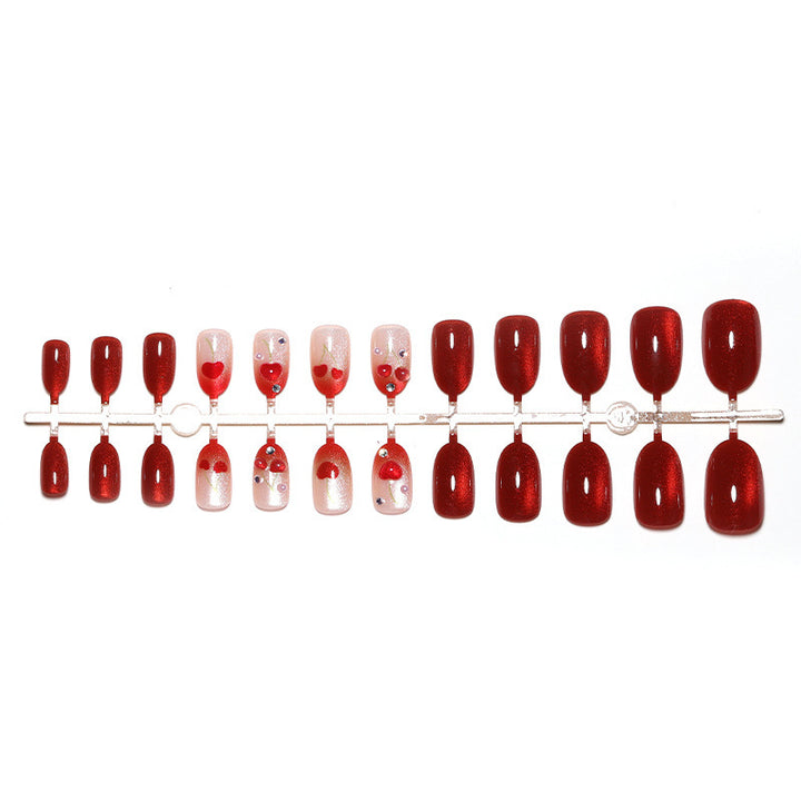 Artificial nail set with glamorous accents and creative heart motifs Kalsten