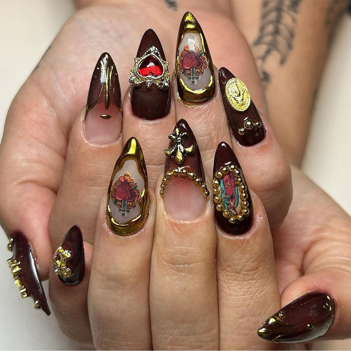 Artistic stiletto nails with detailed embellishments Kalsten