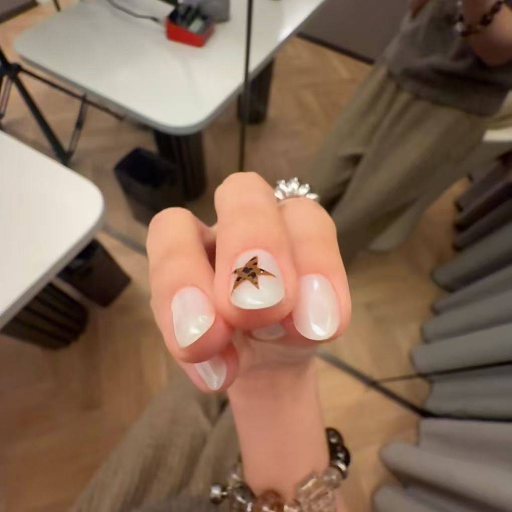 Elegant Nail Art Extensions with Star Accents